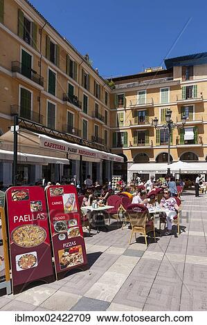 Stock Photo - Central street cafes offering paella on Placa de Major square, historic town centre, Palma de Majorca, Majorca, Balearic Islands, Spain, Europe. Fotosearch