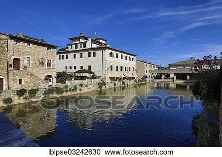 "Central village square with pools of hot spring, """"Square of Sources"""", with the Le Terme Hotel, Bagno Vignioni, San Quirico d'Orcia, Val d'Orcia, Province of Siena, Tuscany, Italy, Europe" View Large Photo Image Stock Image - "Central village square with pools of hot spring, """"Square of Sources"""", with the Le Terme Hotel, Bagno Vignioni, San Quirico d'Orcia, Val d'Orcia, Province of Siena, Tuscany, Italy, Europe". Fotosearch