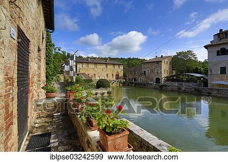 "Central village square with pools of hot spring, """"Square of Sources"""", Bagno Vignioni, San Quirico d'Orcia, Val d'Orcia, Province of Siena, Tuscany, Italy, Europe" View Large Photo Image Stock Photo - "Central village square with pools of hot spring, """"Square of Sources"""", Bagno Vignioni, San Quirico d'Orcia, Val d'Orcia, Province of Siena, Tuscany, Italy, Europe". Fotosearch