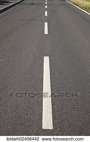 Stock Image - "Centre strip on a straight road, Kamen, Ruhr area, North Rhine-Westphalia, Germany, Europe, PublicGround, Europe". Fotosearch