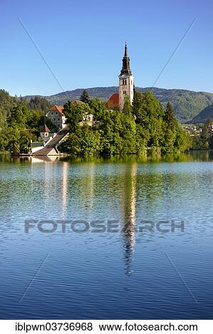Stock Photo - "Cerkev Marijinega vnebovzetja or Assumption Church on Bled Island in the middle of Lake Bled, Bled, Upper Carniola, Slovenia, Europe". Fotosearch