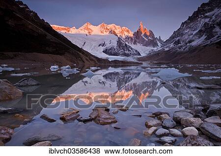 "Cerro Torre massif, reflections in Lake Torre, at dawn, Los Glaciares National Park, El Chalten, Santa Cruz, Argentina, South America" View Large Photo Image Stock Photo - "Cerro Torre massif, reflections in Lake Torre, at dawn, Los Glaciares National Park, El Chalten, Santa Cruz, Argentina, South America". Fotosearch