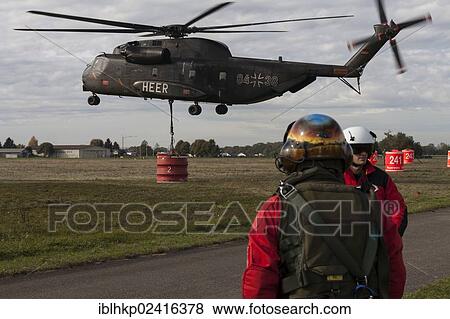 CH-53 helicopter carrying a 5000-liter water tank during an exercise, firefighters, Laupheim, Baden-Wuerttemberg, Germany, Europe View Large Photo Image Stock Photo - CH-53 helicopter carrying a 5000-liter water tank during an exercise, firefighters, Laupheim, Baden-Wuerttemberg, Germany, Europe. Fotosearch