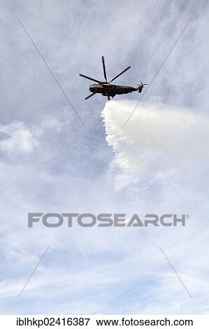 CH-53 helicopter carrying a water tank during an exercise, dropping 5000 liters of water, Laupheim, Baden-Wuerttemberg, Germany, Europe View Large Photo Image Stock Photo - CH-53 helicopter carrying a water tank during an exercise, dropping 5000 liters of water, Laupheim, Baden-Wuerttemberg, Germany, Europe. Fotosearch