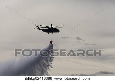 CH-53 helicopter carrying a water tank during an exercise, dropping 5000 liters of water, Laupheim, Baden-Wuerttemberg, Germany, Europe View Large Photo Image Stock Photograph - CH-53 helicopter carrying a water tank during an exercise, dropping 5000 liters of water, Laupheim, Baden-Wuerttemberg, Germany, Europe. Fotosearch
