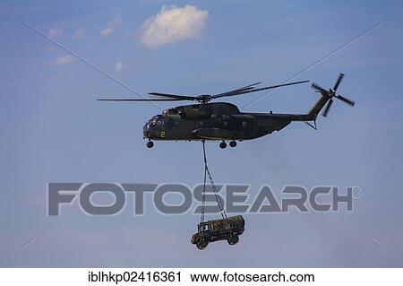 CH-53 helicopter carrying an unimog at an air show in Laupheim, Baden-Wuerttemberg, Germany, Europe View Large Photo Image Stock Image - CH-53 helicopter carrying an unimog at an air show in Laupheim, Baden-Wuerttemberg, Germany, Europe. Fotosearch