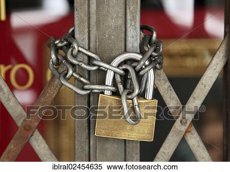 "Chain secured with a padlock, entrance gate" View Large Photo Image Stock Photography - "Chain secured with a padlock, entrance gate". Fotosearch