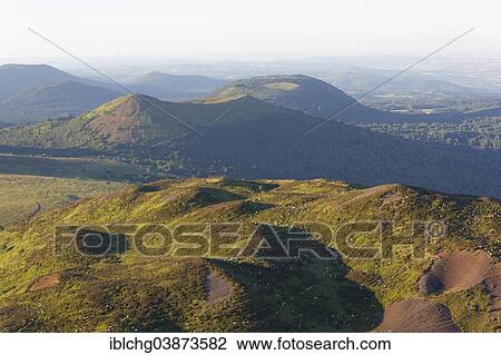 "Chaine des Puys with flock of sheep, Petit-Puy-de-Dome and Puy de Pariou, Parc Naturel Regional des Volcans d'Auvergne, Auvergne, France, Europe" View Large Photo Image Stock Image - "Chaine des Puys with flock of sheep, Petit-Puy-de-Dome and Puy de Pariou, Parc Naturel Regional des Volcans d'Auvergne, Auvergne, France, Europe". Fotosearch