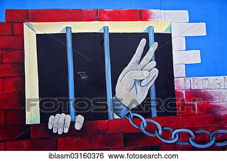 "Chained hand making a peace sign, jail, graffiti at the East Side Gallery, Berlin Wall, Berlin, Berlin, Germany, Europe" View Large Photo Image Stock Photograph - "Chained hand making a peace sign, jail, graffiti at the East Side Gallery, Berlin Wall, Berlin, Berlin, Germany, Europe". Fotosearch