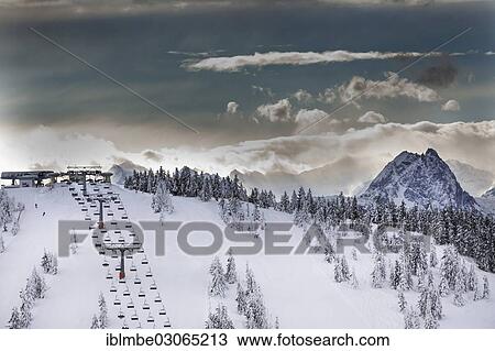 "Chair lift on Eiberg Mountain in the Wilder Kaiser Ski World, summit of Grosse Rettenstein Mountain, 2366m, on the right, Skiwelt Wilder Kaiser, Scheffau am Wilden Kaiser, Tyrol, Austria, Europe" View Large Photo Image Stock Image - "Chair lift on Eiberg Mountain in the Wilder Kaiser Ski World, summit of Grosse Rettenstein Mountain, 2366m, on the right, Skiwelt Wilder Kaiser, Scheffau am Wilden Kaiser, Tyrol, Austria, Europe". Fotosearch