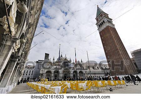 "Chairs and tables on St. Mark's Square, St. Mark's Basilica and St Mark's Campanile, Venice, Venice, Veneto, Italy, Europe" View Large Photo Image Stock Image - "Chairs and tables on St. Mark's Square, St. Mark's Basilica and St Mark's Campanile, Venice, Venice, Veneto, Italy, Europe". Fotosearch