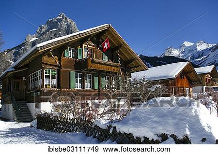 "Chalet with a Swiss flag, Bire Mountain on the left, Blueemlisalp Massif on the right, winter landscape, Bernese Alps, Kandersteg, Canton of Bern, Switzerland, Europe" View Large Photo Image Stock Photo - "Chalet with a Swiss flag, Bire Mountain on the left, Blueemlisalp Massif on the right, winter landscape, Bernese Alps, Kandersteg, Canton of Bern, Switzerland, Europe". Fotosearch