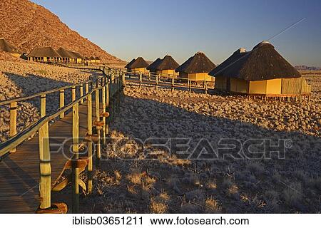 "Chalets or cabins of the Sossus Dune Lodge in the evening light, Sossusvlei, Namib Desert, Namib Naukluft Park, Namibia, Africa" View Large Photo Image Stock Image - "Chalets or cabins of the Sossus Dune Lodge in the evening light, Sossusvlei, Namib Desert, Namib Naukluft Park, Namibia, Africa". Fotosearch