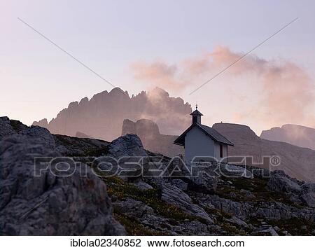 Stock Image - "Chapel at dawn, Dolomiti di Sesto National Park, Sexten Dolomites, Hochpustertal, High Puster Valley, South Tyrol, Italy, Europe". Fotosearch