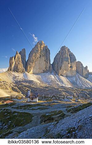 Stock Photograph - "Chapel of Dreizinnenhuette or Three Peaks Alpine hut in front of the north face of the Three Peaks, Sextner Dolomiten, South Tyrol province, Trentino-Alto Adige, Italy, Europe". Fotosearch