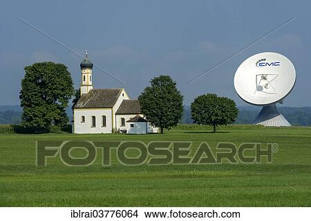 "Chapel of St. John in the Field in front of a parabolic antenna from the Erdfunkstelle Raisting earth station, Pfaffenwinkel, Upper Bavaria, Bavaria, Germany, Europe" View Large Photo Image Picture - "Chapel of St. John in the Field in front of a parabolic antenna from the Erdfunkstelle Raisting earth station, Pfaffenwinkel, Upper Bavaria, Bavaria, Germany, Europe". Fotosearch