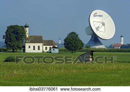 "Chapel of St. John in the Field in front of a parabolic antenna from the Erdfunkstelle Raisting earth station, Pfaffenwinkel, Upper Bavaria, Bavaria, Germany, Europe" View Large Photo Image Stock Image - "Chapel of St. John in the Field in front of a parabolic antenna from the Erdfunkstelle Raisting earth station, Pfaffenwinkel, Upper Bavaria, Bavaria, Germany, Europe". Fotosearch