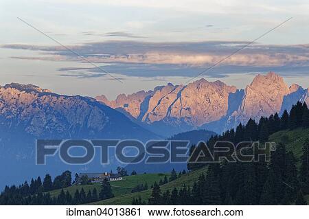 Stock Image - "Chapel of St. Leonhard, Sudelfeld, Mangfall mountains, Wilder Kaiser in Austria at the back, Upper Bavaria, Bavaria, Germany, Europe". Fotosearch