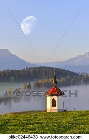"Chapel on Lake Hegratsried, near Fuessen, moon, composing, Allgaeu, Bavaria, Germany, Europe" View Large Photo Image Stock Image - "Chapel on Lake Hegratsried, near Fuessen, moon, composing, Allgaeu, Bavaria, Germany, Europe". Fotosearch