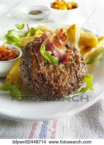 Char-grilled beef burger with chunky chips and salad View Large Photo Image Picture - Char-grilled beef burger with chunky chips and salad. Fotosearch