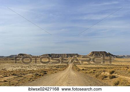 "Characteristic bizarre landscape of ocher clay, semidesert Bardenas Reales, UNESCO Biosphere Reserve, Navarra, northern Spain, Spain, Europe, PublicGround, Europe" View Large Photo Image Stock Photo - "Characteristic bizarre landscape of ocher clay, semidesert Bardenas Reales, UNESCO Biosphere Reserve, Navarra, northern Spain, Spain, Europe, PublicGround, Europe". Fotosearch