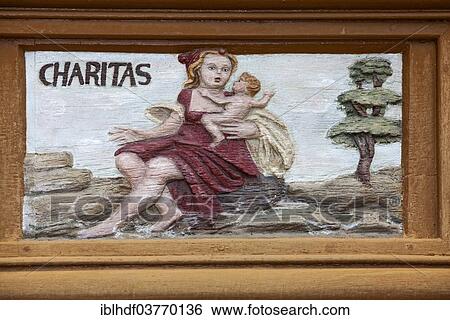 "Charitas, Latin for charity, wood carving, Alte Lateinschule Alfeld building, Alfeld, Lower Saxony, Germany, Europe" View Large Photo Image Stock Photograph - "Charitas, Latin for charity, wood carving, Alte Lateinschule Alfeld building, Alfeld, Lower Saxony, Germany, Europe". Fotosearch