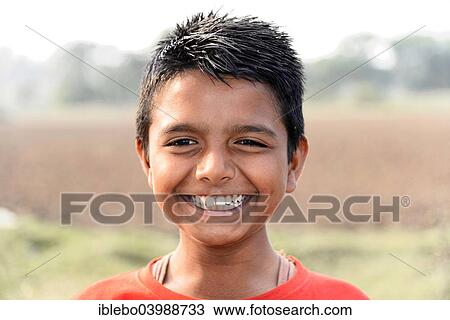 Stock Image - "Cheerful Indian boy, portrait, at Mumbai, Maharashtra, India, Asia". Fotosearch