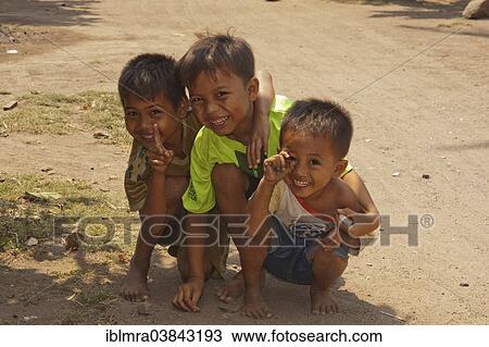 "Cheerful local kids, Seminyak, Bali, Indonesia, Asia" View Large Photo Image Stock Image - "Cheerful local kids, Seminyak, Bali, Indonesia, Asia". Fotosearch