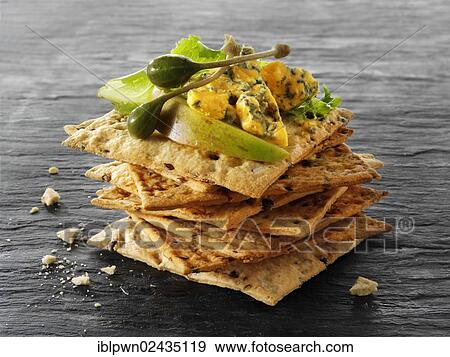 Stock Photo - Cheese and biscuits with Blacksticks Blue cheese. Fotosearch