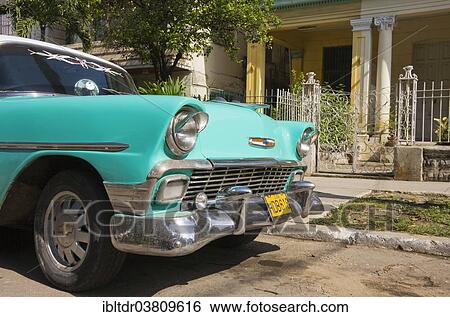 Stock Photograph - "Chevrolet, classic car parked in the streets of Havana, Havana, Cuba, North America". Fotosearch