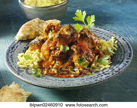 Stock Image - "Chicken Dopiaza curry and rice, Indian cuisine". Fotosearch