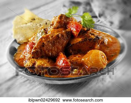 Stock Image - "Chicken Jalfrezi, traditional Indian recipe". Fotosearch