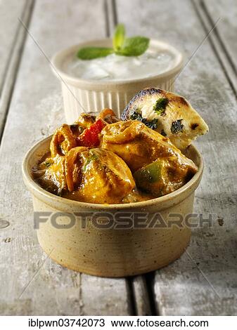 Stock Image - "Chicken Jalfrezi, traditional Indian curry". Fotosearch