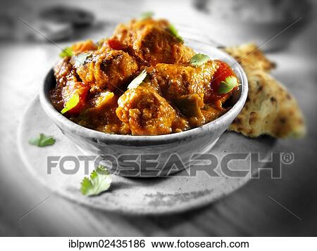 Stock Photograph - "Chicken Jalfrezi, traditional Indian recipe". Fotosearch