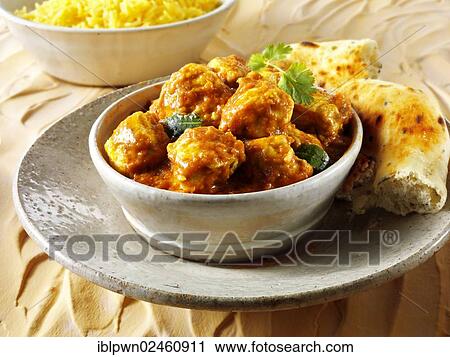 Stock Image - "Chicken Madras with Pilau rice and Naan bread, Indian cuisine". Fotosearch