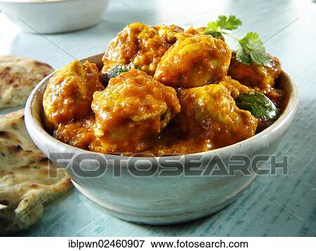 Stock Photo - "Chicken Madras with Pilau rice and Naan bread, Indian cuisine". Fotosearch