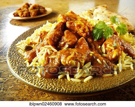 Stock Photo - "Chicken Madras with Pilau rice and Naan bread, Indian cuisine". Fotosearch