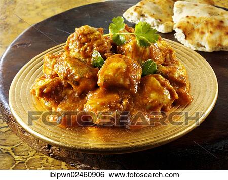 Stock Photograph - "Chicken Madras with Pilau rice and Naan bread, Indian cuisine". Fotosearch