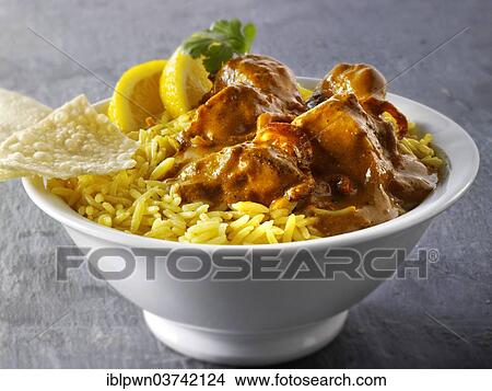 "Chicken Masala, pilau rice and papadum, traditional Indian curry" View Large Photo Image Picture - "Chicken Masala, pilau rice and papadum, traditional Indian curry". Fotosearch