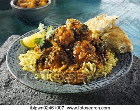 Stock Photo - "Chicken Sag Masala curry and rice, Indian cuisine". Fotosearch
