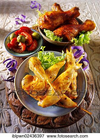 Stock Photo - "Chicken satay and grilled chicken leg, party buffet". Fotosearch