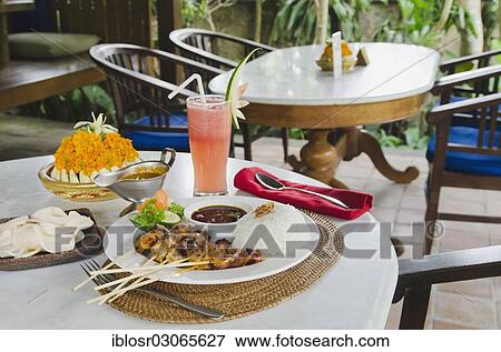 "Chicken satay, chicken skewers and rice, watermelon juice, Indonesian cuisine, Ubud, Bali, Indonesia, Asia" View Large Photo Image Stock Photo - "Chicken satay, chicken skewers and rice, watermelon juice, Indonesian cuisine, Ubud, Bali, Indonesia, Asia". Fotosearch