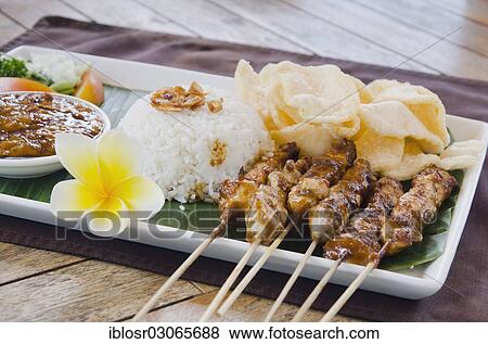 "Chicken satay, chicken skewers with rice, Indonesian cuisine, at a restaurant, Ubud, Bali, Indonesia, Asia" View Large Photo Image Stock Photo - "Chicken satay, chicken skewers with rice, Indonesian cuisine, at a restaurant, Ubud, Bali, Indonesia, Asia". Fotosearch