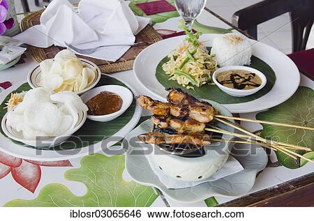 "Chicken satay, chicken skewers with rice, Indonesian cuisine, at a restaurant, Candi Dasa, Bali, Indonesia, Asia" View Large Photo Image Stock Photograph - "Chicken satay, chicken skewers with rice, Indonesian cuisine, at a restaurant, Candi Dasa, Bali, Indonesia, Asia". Fotosearch