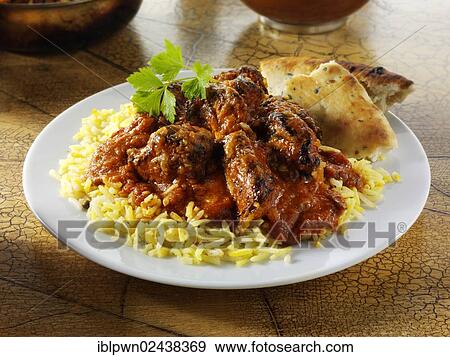 Stock Photo - "Chicken Tikka Masala curry and rice, Indian food". Fotosearch