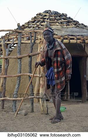 "Chief Hikuminue Kapika, chief of the Namibian Himba in front of his hut, Omuramba, Kaokoland, Kunene, Namibia, Africa" View Large Photo Image Stock Image - "Chief Hikuminue Kapika, chief of the Namibian Himba in front of his hut, Omuramba, Kaokoland, Kunene, Namibia, Africa". Fotosearch