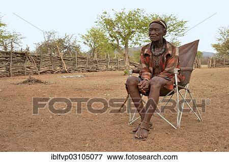 "Chief Hikuminue Kapika, chief of the Namibian Himba, in his kraal, Omuramba, Kaokoland, Kunene, Namibia, Africa" View Large Photo Image Stock Photo - "Chief Hikuminue Kapika, chief of the Namibian Himba, in his kraal, Omuramba, Kaokoland, Kunene, Namibia, Africa". Fotosearch