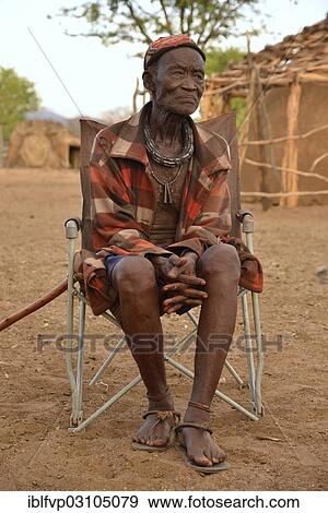 "Chief Hikuminue Kapika, chief of the Namibian Himba, in his kraal, Omuramba, Kaokoland, Kunene, Namibia, Africa" View Large Photo Image Stock Photo - "Chief Hikuminue Kapika, chief of the Namibian Himba, in his kraal, Omuramba, Kaokoland, Kunene, Namibia, Africa". Fotosearch
