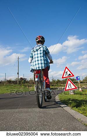 Child approaching a construction site sign at a traffic awareness course View Large Photo Image Picture - Child approaching a construction site sign at a traffic awareness course. Fotosearch