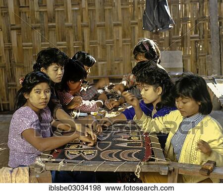 Stock Photo - "Child labour, young girls with thanaka paste on their faces at work, Mandalay, Mandalay Division, Myanmar, Burma, Asia". Fotosearch